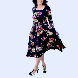 Powerful modestly dress women in a floral dress