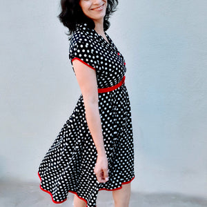 Powerful modestly dress women in a polkadot dress